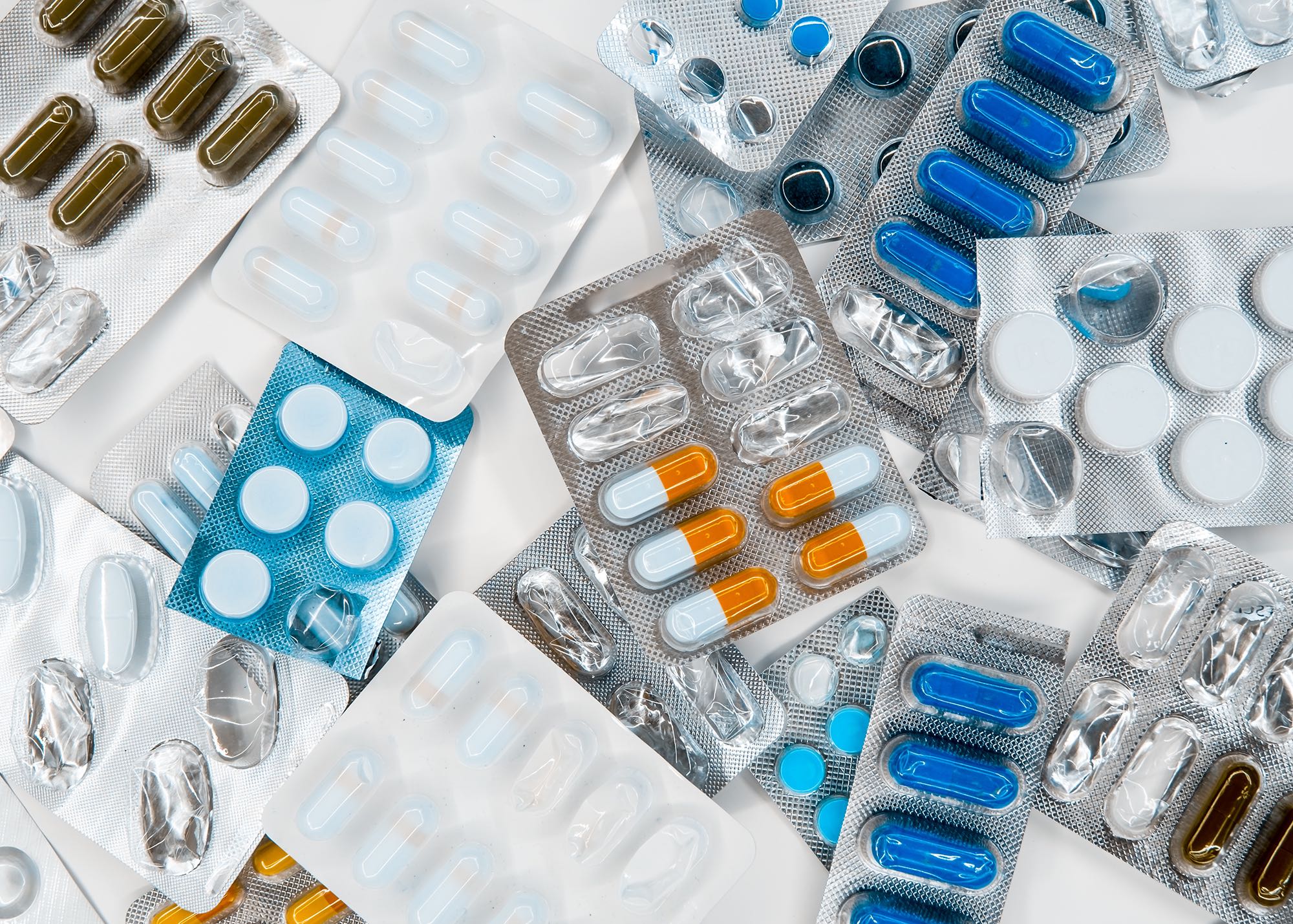 Several packets of different medicines in pill form