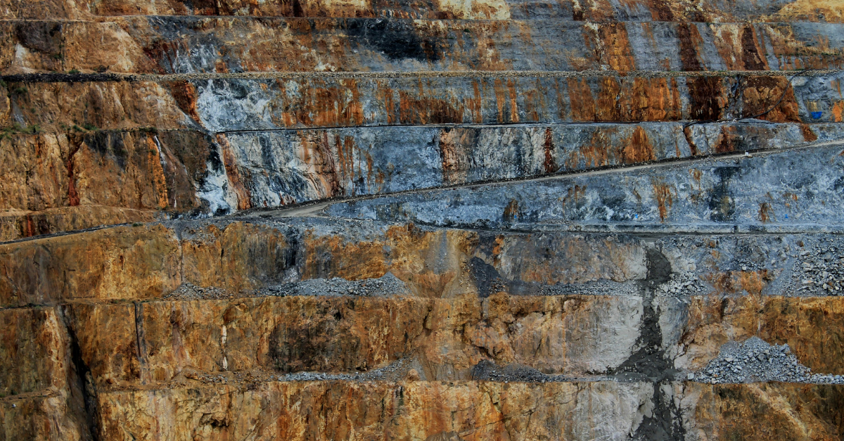 Open-pit mining site representing UFLPA high-priority sectors such as steel, copper, and lithium supply chains under DHS and CBP enforcement.